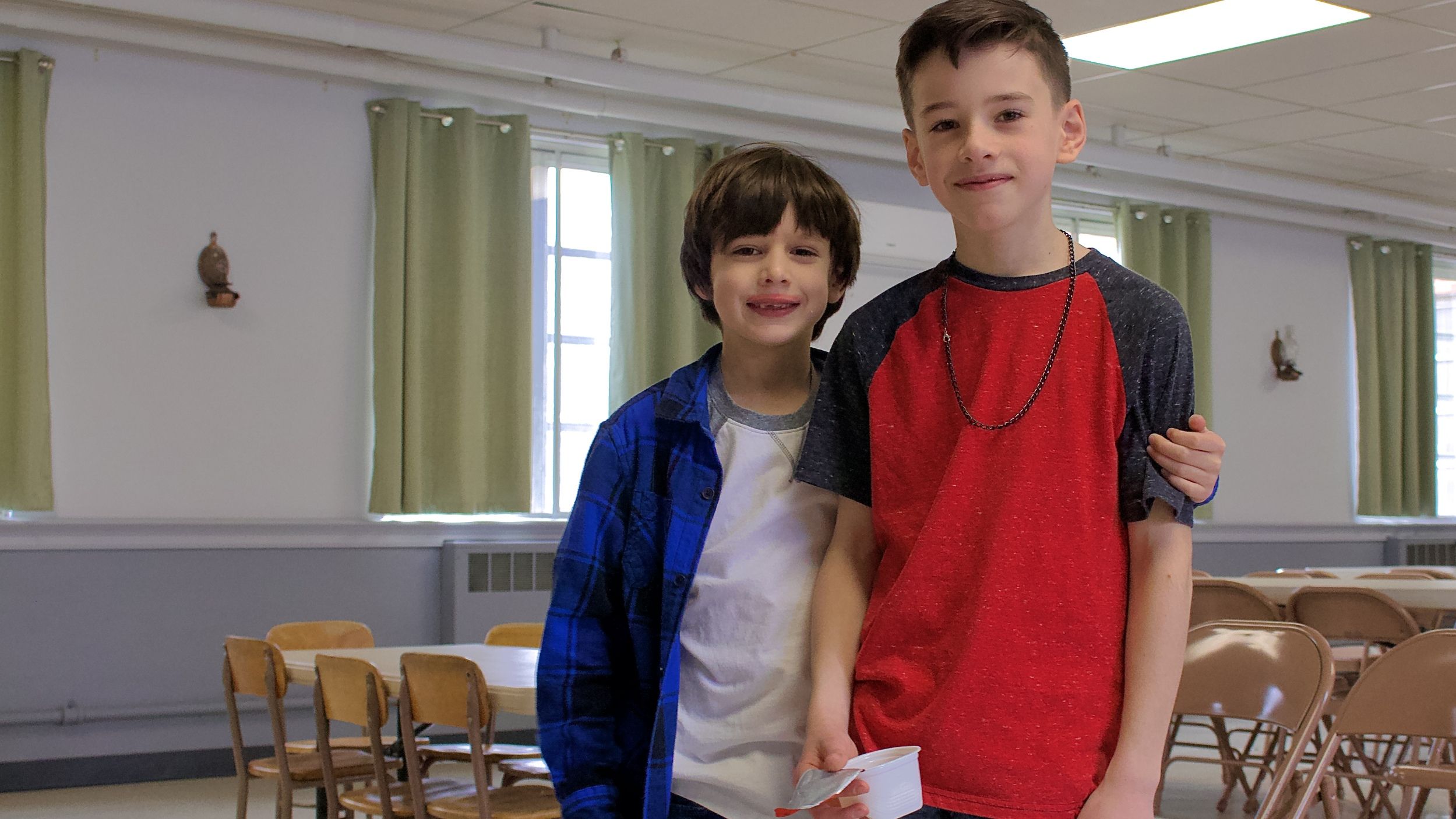 Two boys smiling at church